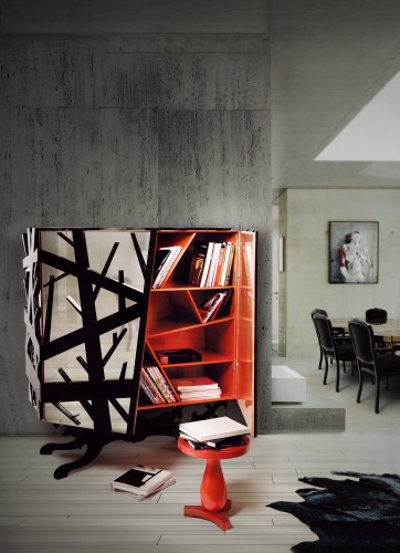 Forest Cabinet has a wooden structure, which is covered with a special mesh. The base is carved from mahogany and the interior is compartmentalized with angling shelves covered in gold leaf finished with a translucent orange high gloss varnish. A design by Boca do Lobo.